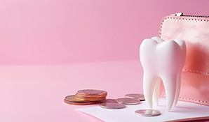 Large model tooth next to a pile of coins and a leather coin purse with pink background